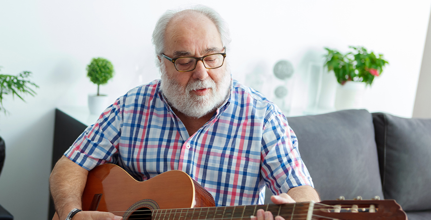 man playing guitar music and dementia