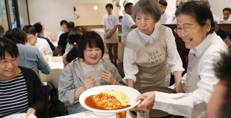 poeple with dementia serve up food