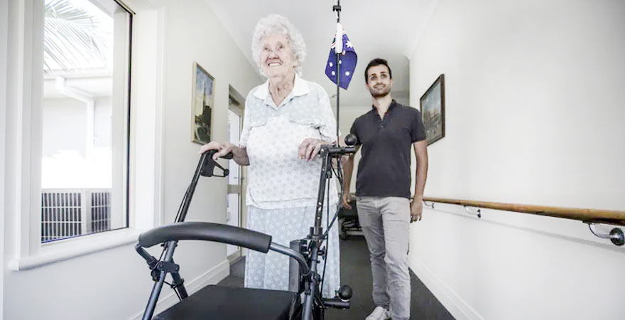 lady with dementia walking with frame adjust temperature settings