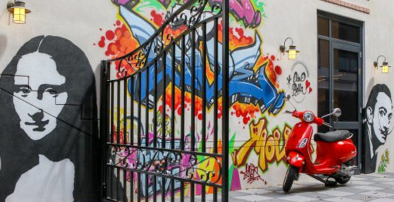 dementia friendly community courtyard with colourful grafitti